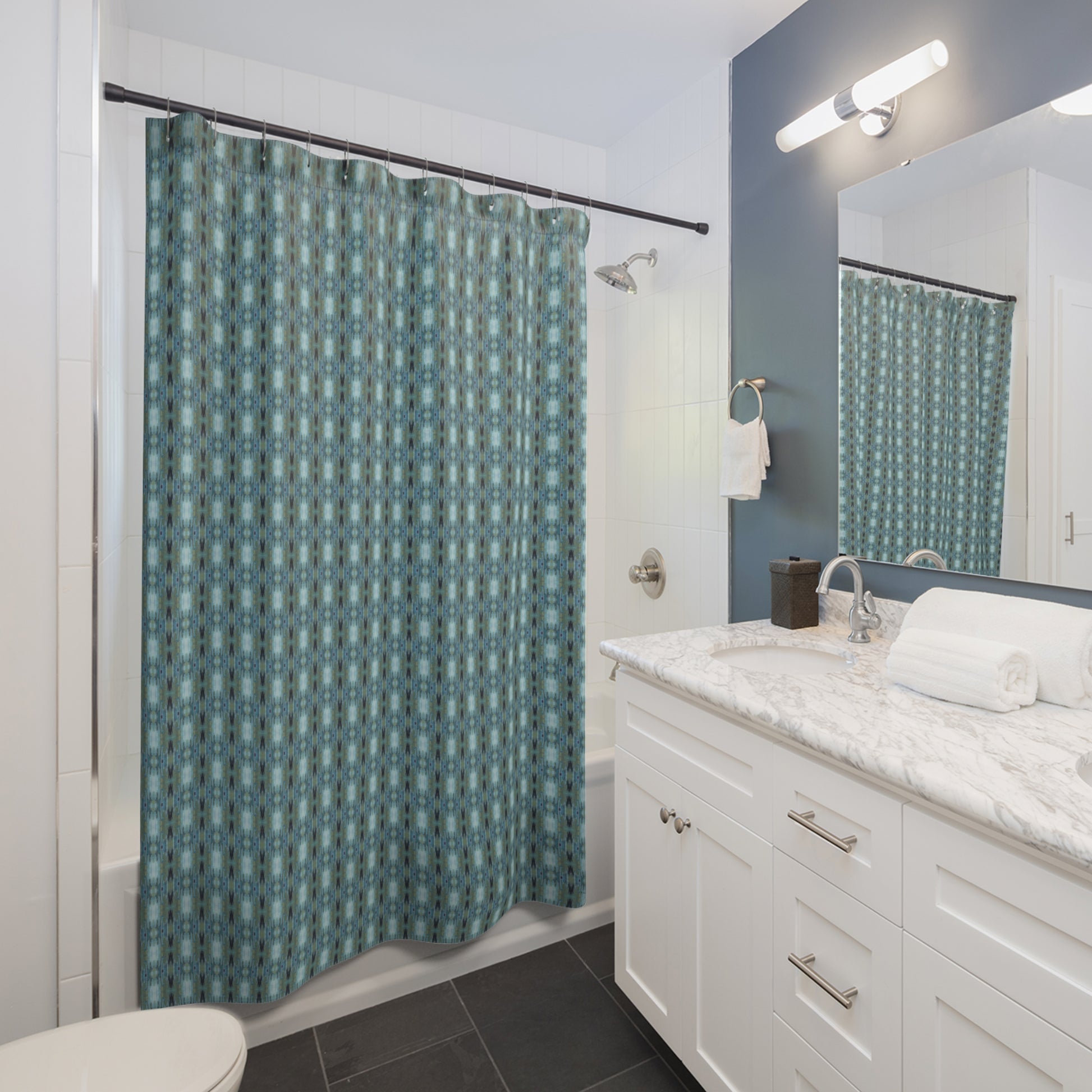 Artisan designed Blue and green geometric pattern. Made of highly durable soft polyester. Why did we choose polyester over cotton for our shower curtain material?    dryies quickly to resists mold (vs. cotton shower curtains retain moisture and take longer to dry) Wrinkle resistant, they stay fresh and crisp looking at all times (vs. cotton shower curtains stay wrinkled and require ironing)   Super soft to the touch and machine washable with no shrinkage