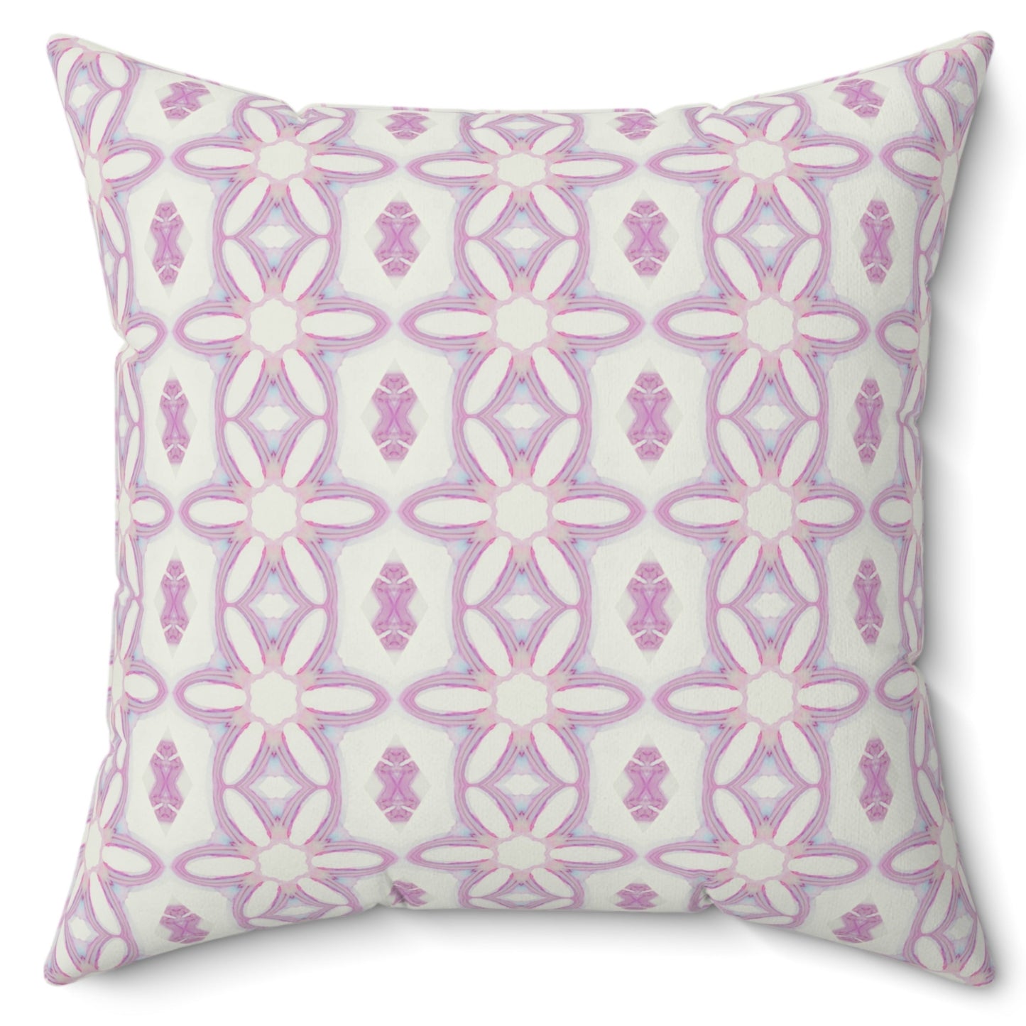 A square-shaped pillow with a hidden zipper, featuring a symmetrical pink and white floral pattern on a poly velvet cover.