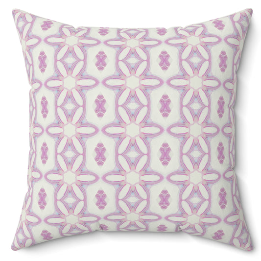 A square-shaped pillow with a hidden zipper, featuring a symmetrical pink and white floral pattern on a poly velvet cover.