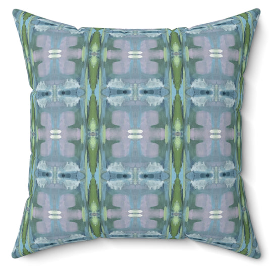 A square-shaped pillow with a two-sided print featuring geometric patterns in shades of blue and green, with a concealed zipper and a silky soft poly velvet cover.