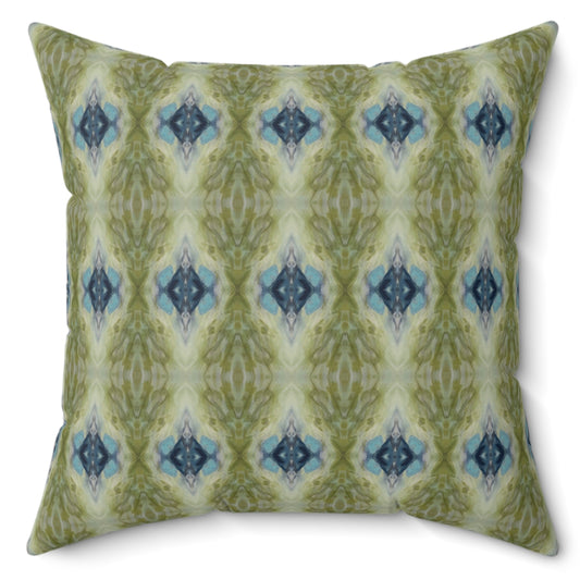 Decorative pillow with green and blue pattern on a white background