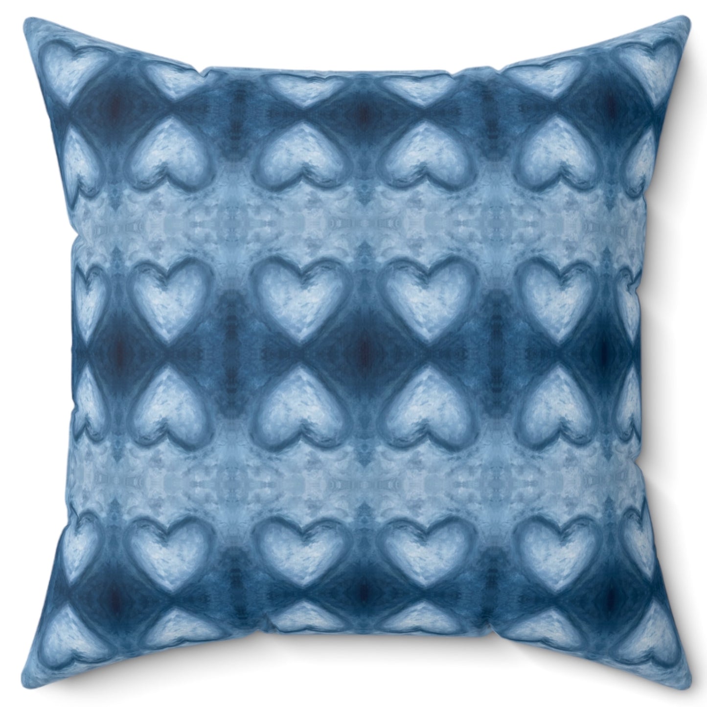 A square-shaped throw pillow with a sapphire blue velvet cover featuring a pattern of white hearts and diamonds on a blue background.