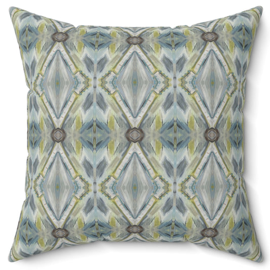 A square-shaped throw pillow with a geometric lattice pattern featuring shades of blue and green.