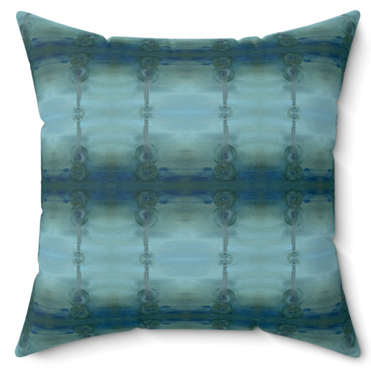 A square-shaped throw pillow with a pattern that resembles an acoustic guitar, featuring shades of blue and green.