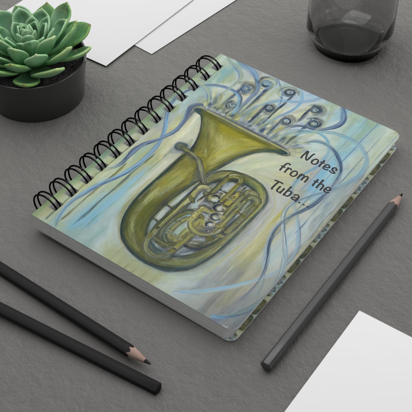 Notes from the Tuba!  Write down your dreams in style in our spiral-bound journal featuring "Tuba Tuba". Our notebooks feature a durable thick gloss laminated protective cover, with pattern repeat created from the original artwork on the inside front and back covers.  Made in the USA!  Journal comes in 5x7 size with 150 pages of lined paper with preforated eadge for easy tear removal!   .: Front, back and inside cover print .: 150 lined pages (75 sheets) .: Glossy laminated cover