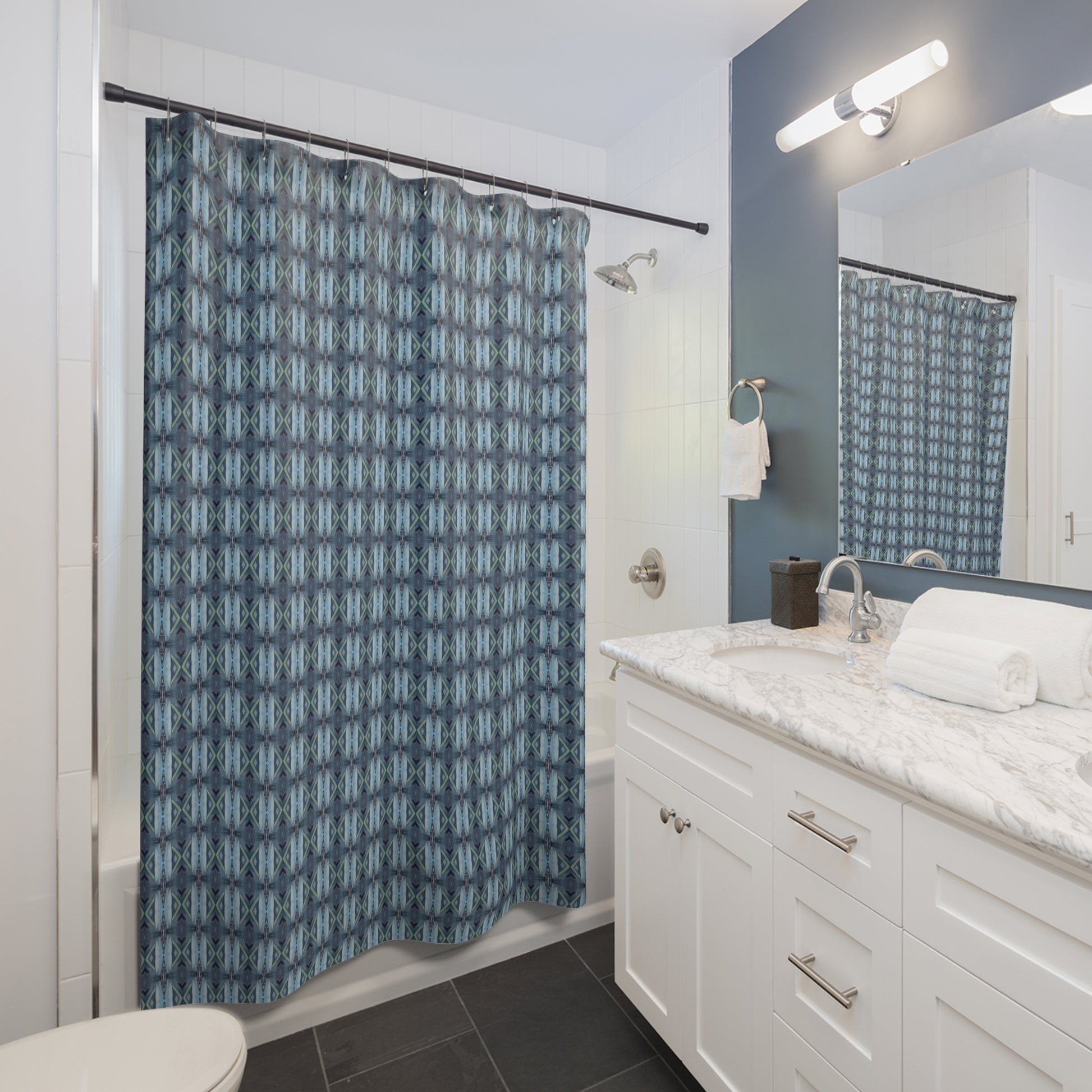 A life style photo of PALMER K designs blue geometric shower curtain. Strong masculine pattern but soft enough for a boys bathroom.  Artisan designed, super soft to the touch, will dry quickly to resist mold and mildew.  Stays fresh looking at all times. The perfect touch for maintenence free bathroom decor