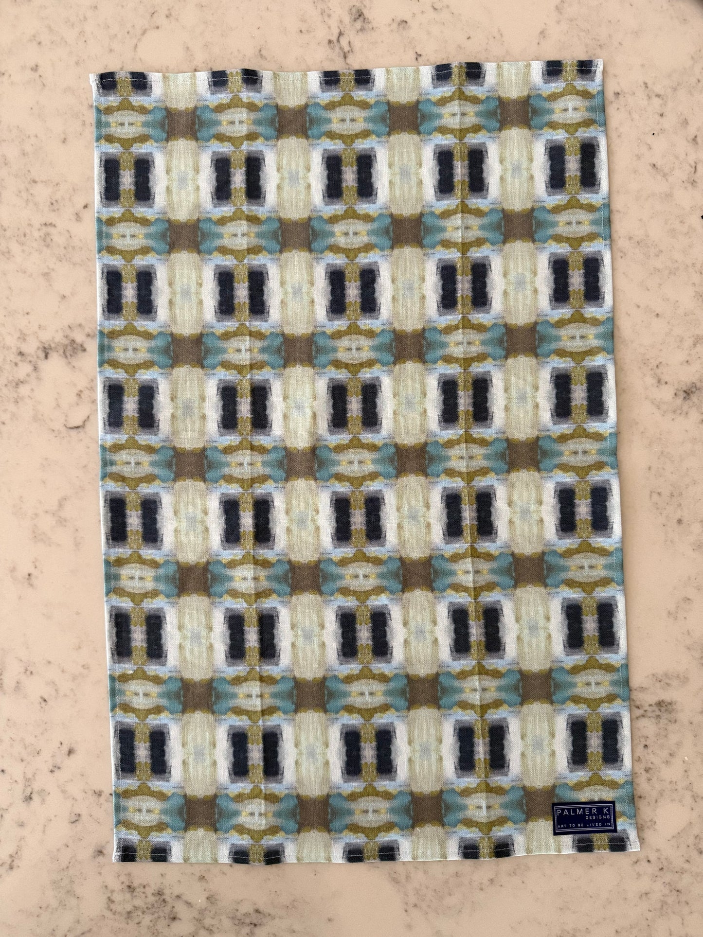 Crafted from 100% French linen woven from premium Normandy flax, each tea towel is printed and sewn in the USA and designed to bring lasting beauty into the kitchen and bath.  Measuring 16x24 inches, the fabric offers the ideal balance of structure and softness - becoming more supple with every wash while maintaining its integrity.

Each pattern begins as an original fine art painting, translated into a layered geometric composition that preserves the movement, texture, and tonal depth of the artwork.  The 