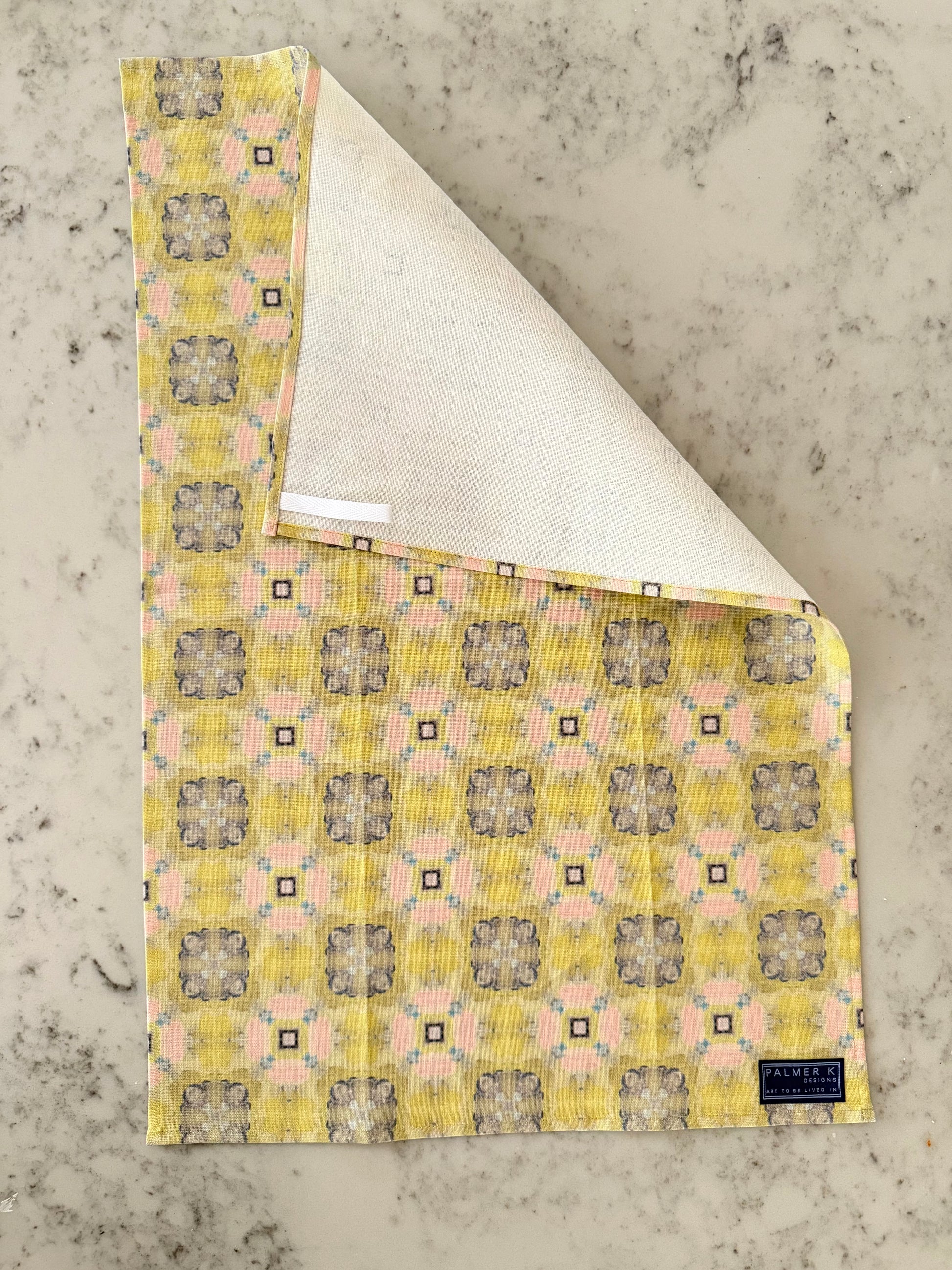 Crafted from 100% French linen woven from premium Normandy flax, each tea towel is printed and sewn in the USA and designed to bring lasting beauty into the kitchen and bath.  Measuring 16x24 inches, the fabric offers the ideal balance of structure and softness - becoming more supple with every wash while maintaining its integrity.

Each pattern begins as an original fine art painting, translated into a layered geometric composition that preserves the movement, texture, and tonal depth of the artwork.  The 
