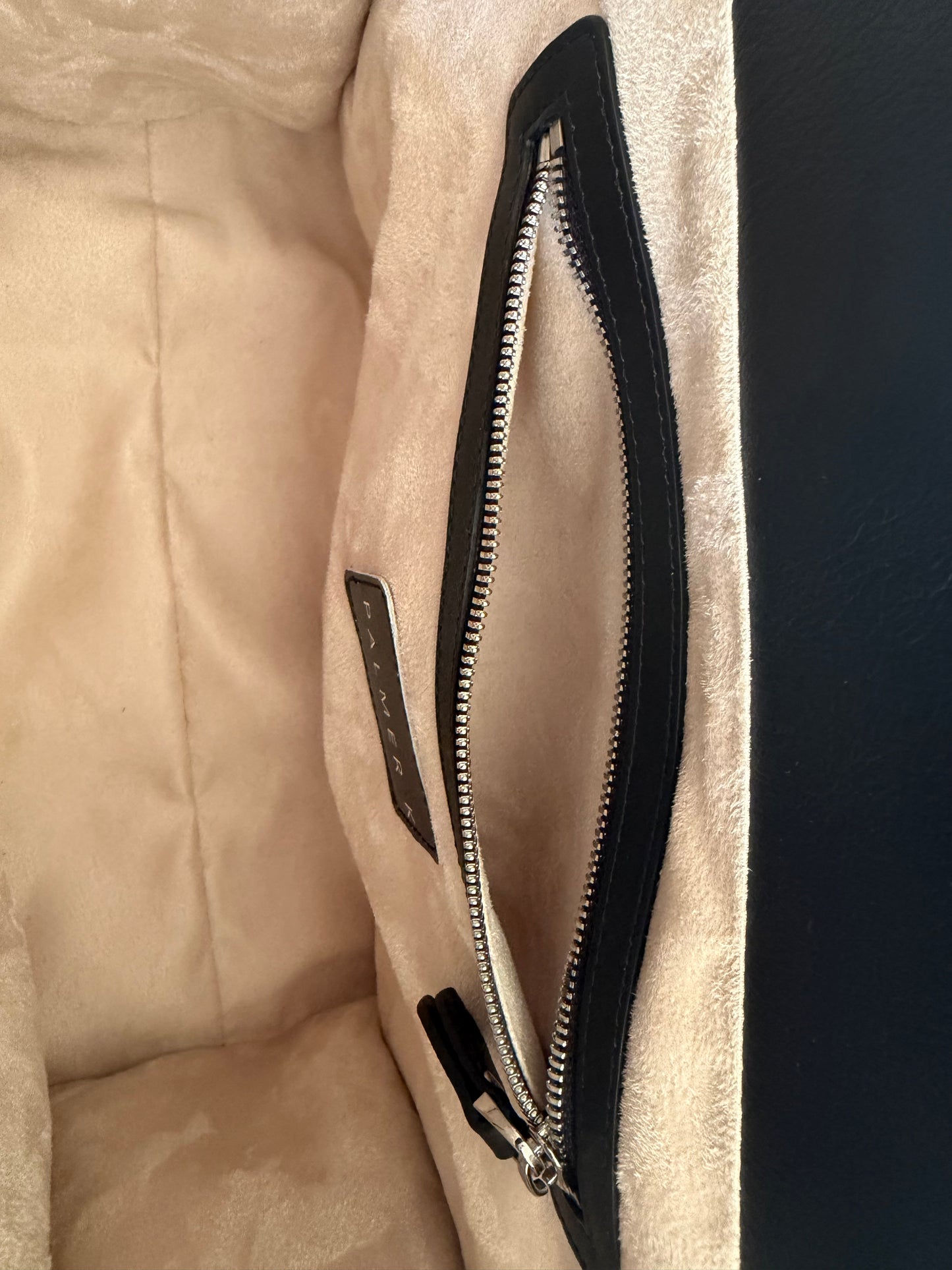 Interior view of the Atelier Tote luxury handbag showing zippered pocket and spacious, structured lining and functional design for everyday essentials in premium Nappa leather tote.