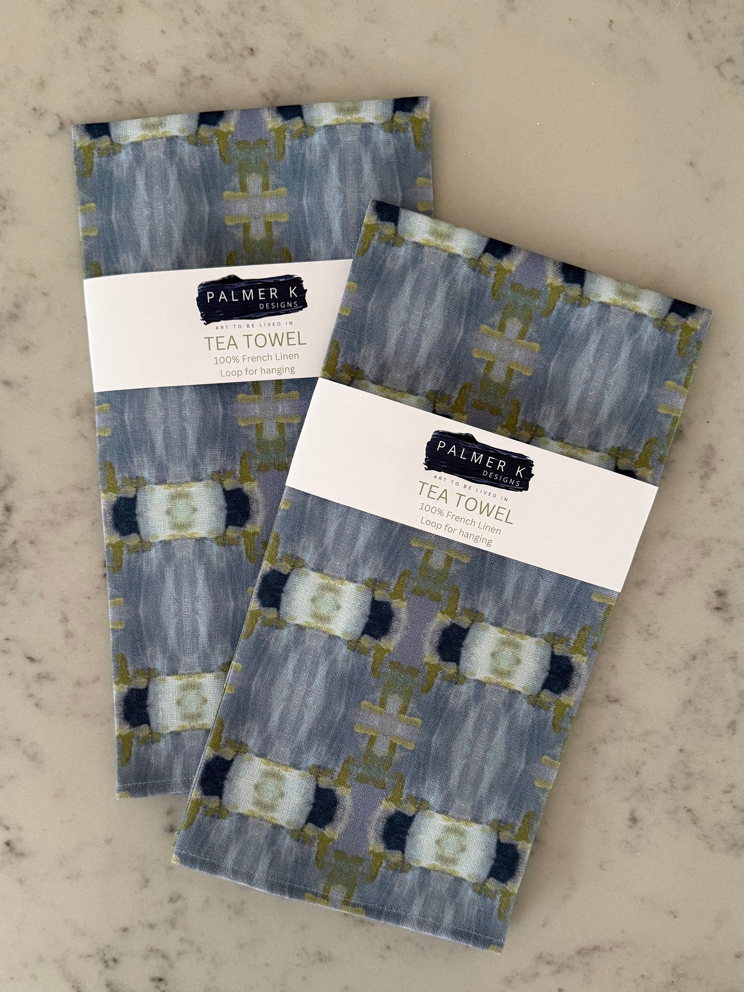 Crafted from 100% French linen woven from premium Normandy flax, each tea towel is printed and sewn in the USA and designed to bring lasting beauty into the kitchen and bath.  Measuring 16x24 inches, the fabric offers the ideal balance of structure and softness - becoming more supple with every wash while maintaining its integrity.

Each pattern begins as an original fine art painting, translated into a layered geometric composition that preserves the movement, texture, and tonal depth of the artwork.  The 