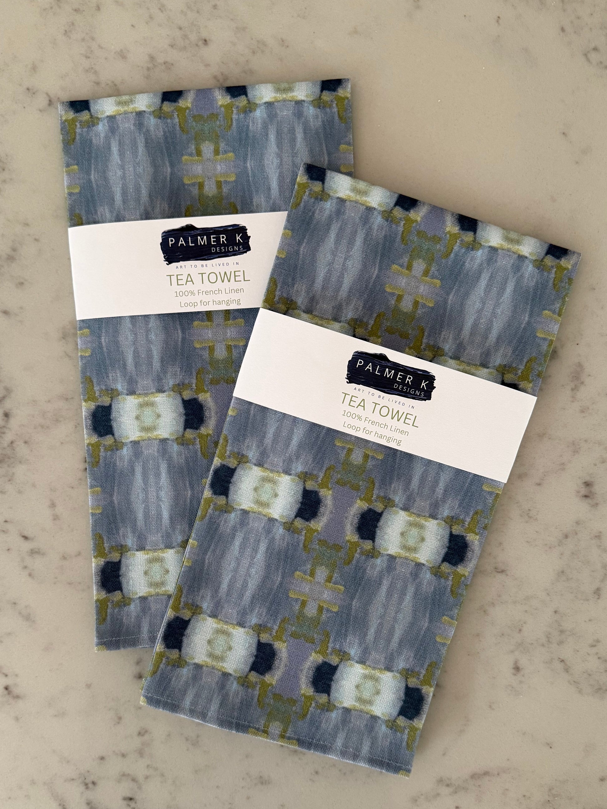 Crafted from 100% French linen woven from premium Normandy flax, each tea towel is printed and sewn in the USA and designed to bring lasting beauty into the kitchen and bath.  Measuring 16x24 inches, the fabric offers the ideal balance of structure and softness - becoming more supple with every wash while maintaining its integrity.

Each pattern begins as an original fine art painting, translated into a layered geometric composition that preserves the movement, texture, and tonal depth of the artwork.  The 