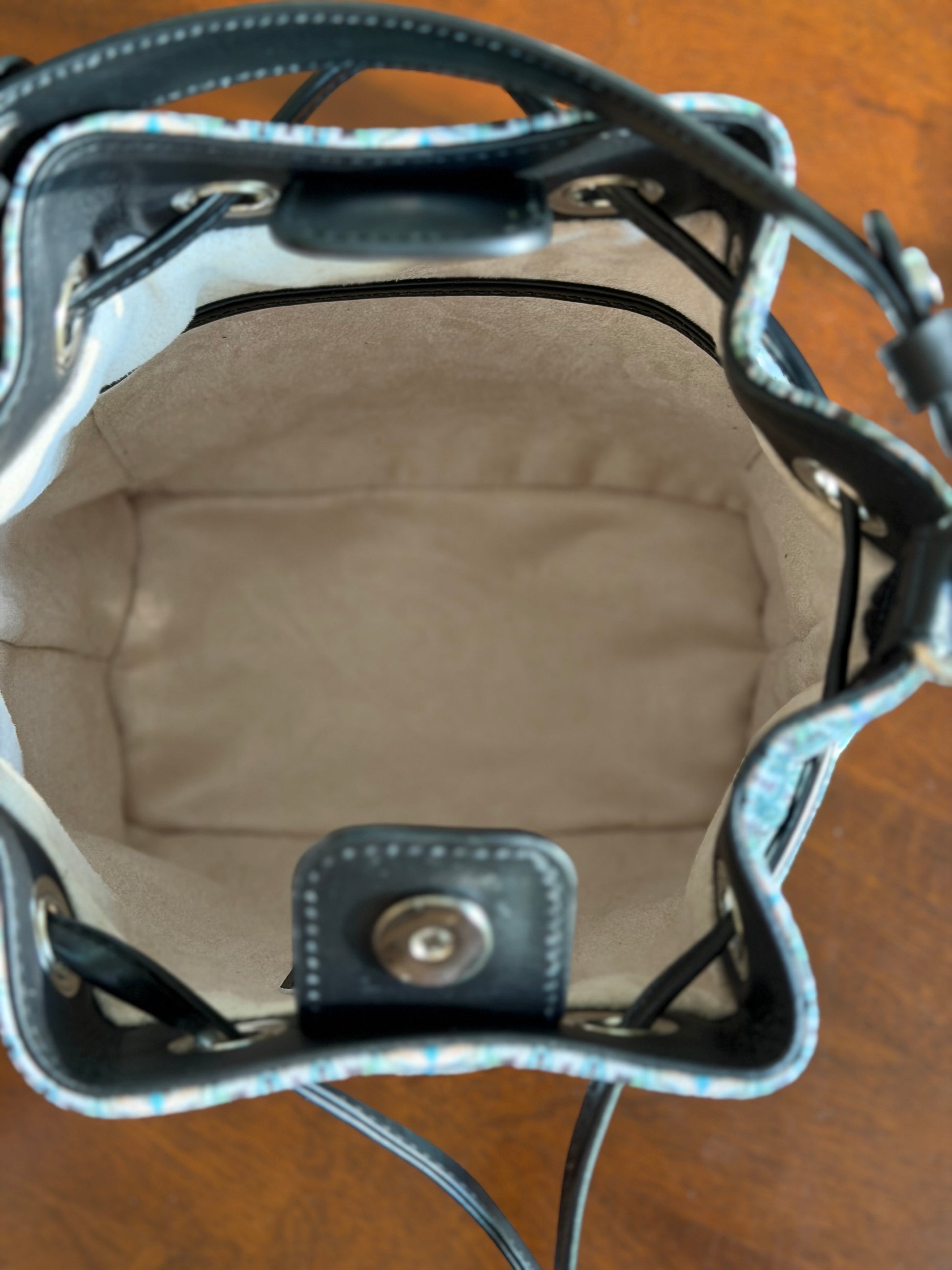 Maison Bucket Bag showing spacious design, functional compartments, and premium craftsmanship for everyday luxury.