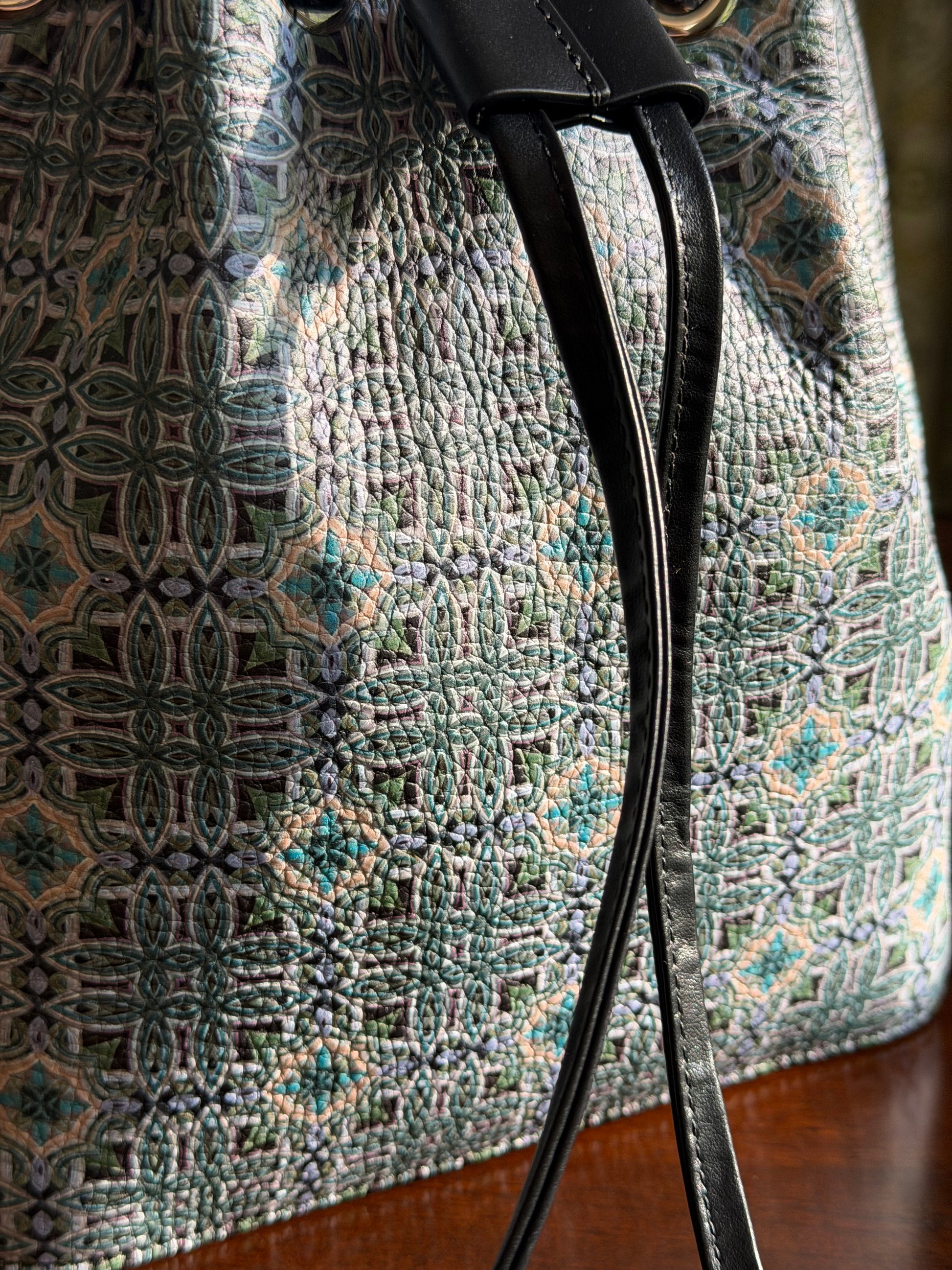 Side profile of Maison Bucket bag highlighting sculptural structure, soft movement and refined craftsmanship in a luxury bucket bag.