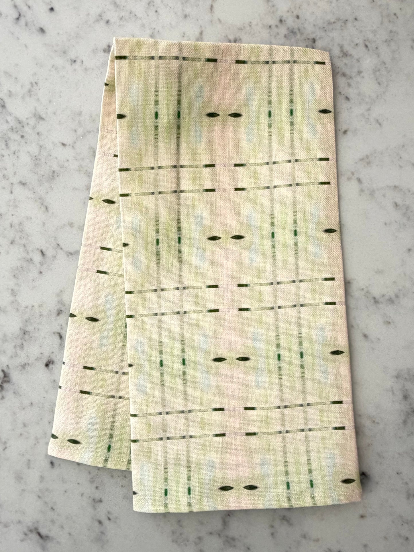 Crafted from 100% French linen woven from premium Normandy flax, each tea towel is printed and sewn in the USA and designed to bring lasting beauty into the kitchen and bath.  Measuring 16x24 inches, the fabric offers the ideal balance of structure and softness - becoming more supple with every wash while maintaining its integrity.

Each pattern begins as an original fine art painting, translated into a layered geometric composition that preserves the movement, texture, and tonal depth of the artwork.  The 
