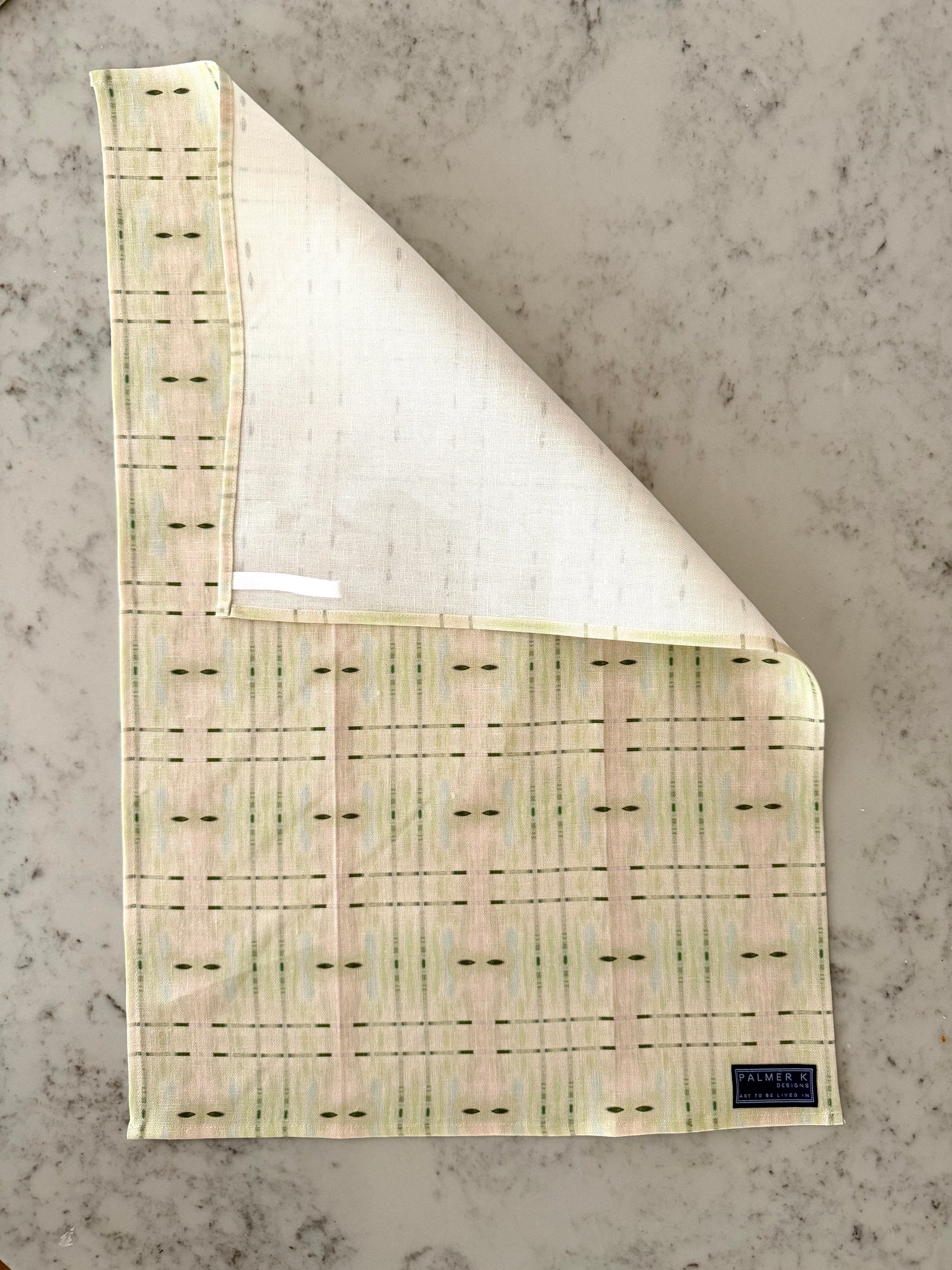 Crafted from 100% French linen woven from premium Normandy flax, each tea towel is printed and sewn in the USA and designed to bring lasting beauty into the kitchen and bath.  Measuring 16x24 inches, the fabric offers the ideal balance of structure and softness - becoming more supple with every wash while maintaining its integrity.

Each pattern begins as an original fine art painting, translated into a layered geometric composition that preserves the movement, texture, and tonal depth of the artwork.  The 