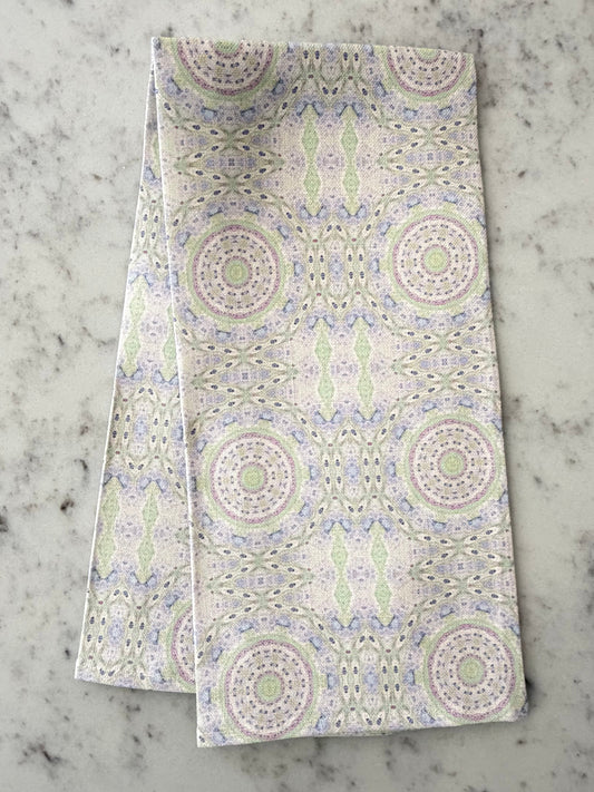 Crafted from 100% French linen woven from premium Normandy flax, each tea towel is printed and sewn in the USA and designed to bring lasting beauty into the kitchen and bath.  Measuring 16x24 inches, the fabric offers the ideal balance of structure and softness - becoming more supple with every wash while maintaining its integrity.

Each pattern begins as an original fine art painting, translated into a layered geometric composition that preserves the movement, texture, and tonal depth of the artwork.  The 