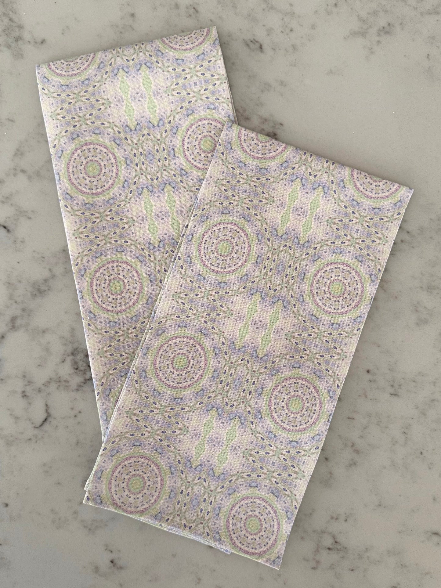 Crafted from 100% French linen woven from premium Normandy flax, each tea towel is printed and sewn in the USA and designed to bring lasting beauty into the kitchen and bath.  Measuring 16x24 inches, the fabric offers the ideal balance of structure and softness - becoming more supple with every wash while maintaining its integrity.

Each pattern begins as an original fine art painting, translated into a layered geometric composition that preserves the movement, texture, and tonal depth of the artwork.  The 