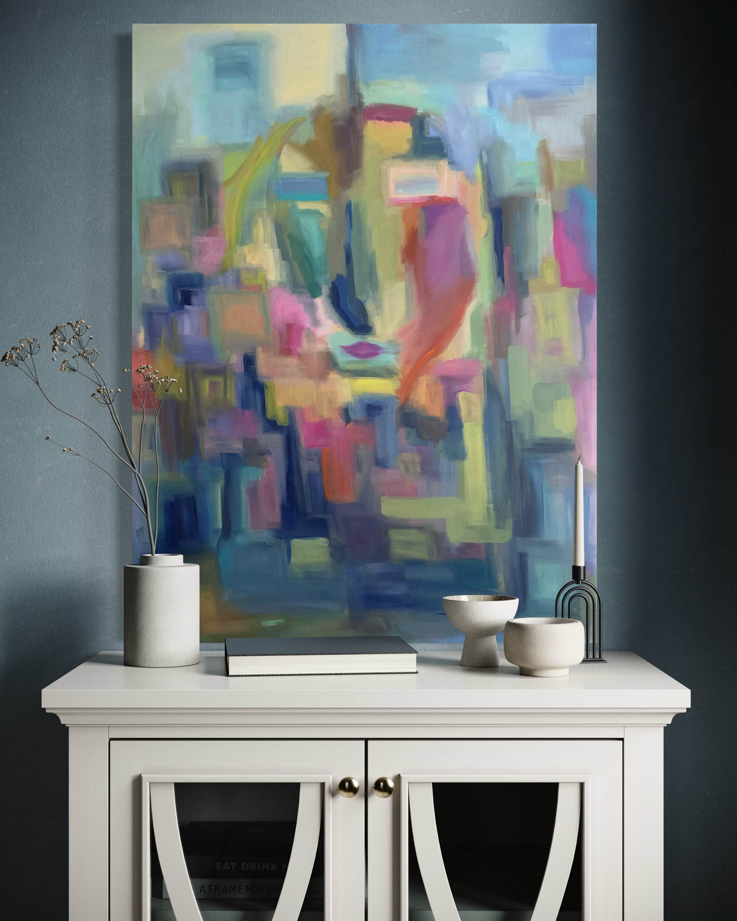 Summer’s Kiss is an original 40 x 40 contemporary landscape painting that brings warmth, color, and atmosphere to sophisticated interiors.  Shown here in a thoughtfully designed living space, this original fine art painting creates a striking foal point while complementing modern, transitional, and luxury home decor.  Inspired by the sensory richness of summer and viewed through a reflective pane of glass, Summer’s Kiss invites moments of nostalgia, connection, and a quiet reflection. 