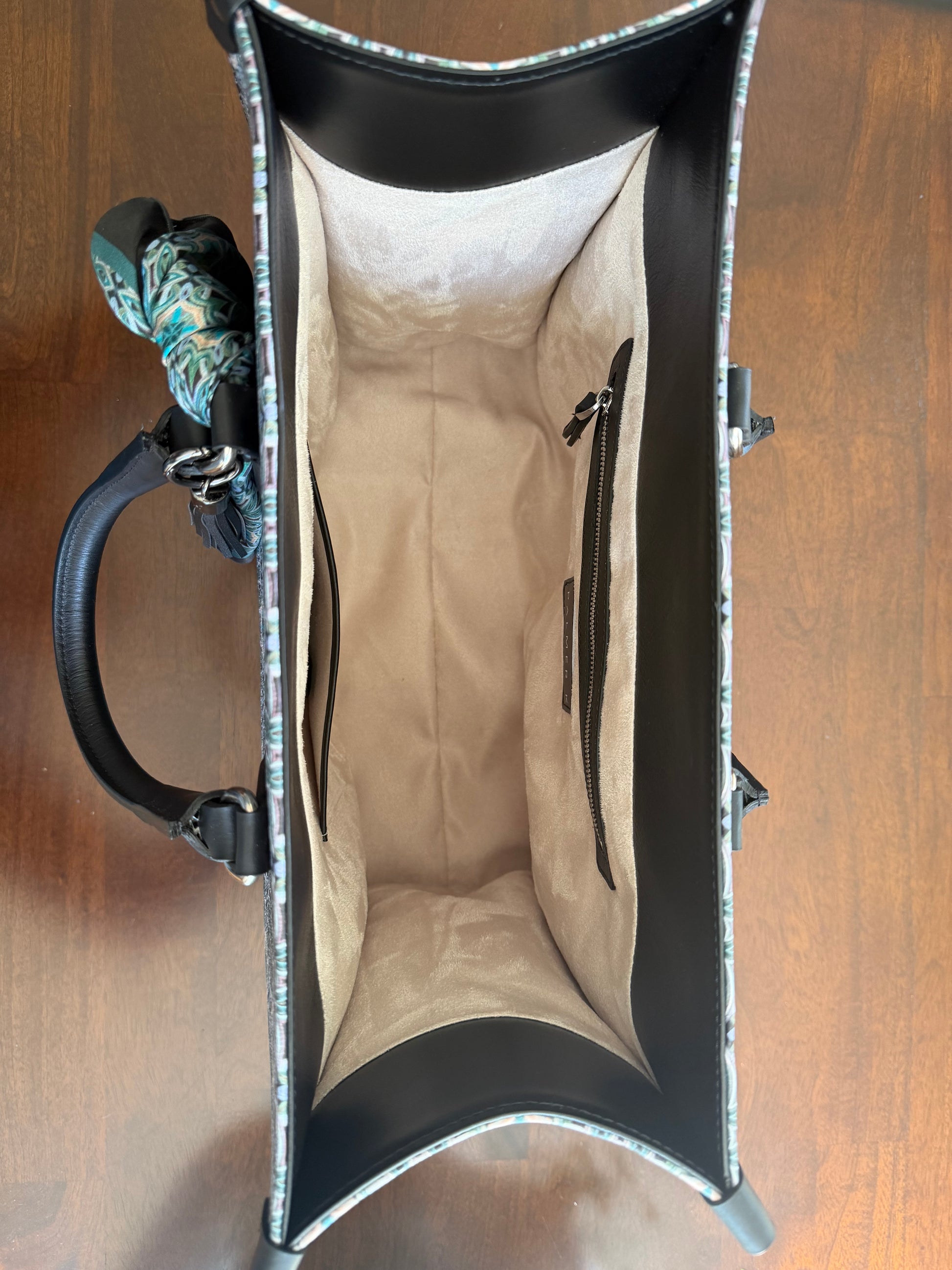 Interior view of the Atelier Tote luxury handbag showing spacious, structured lining and functional design for everyday essentials in premium Nappa leather tote.