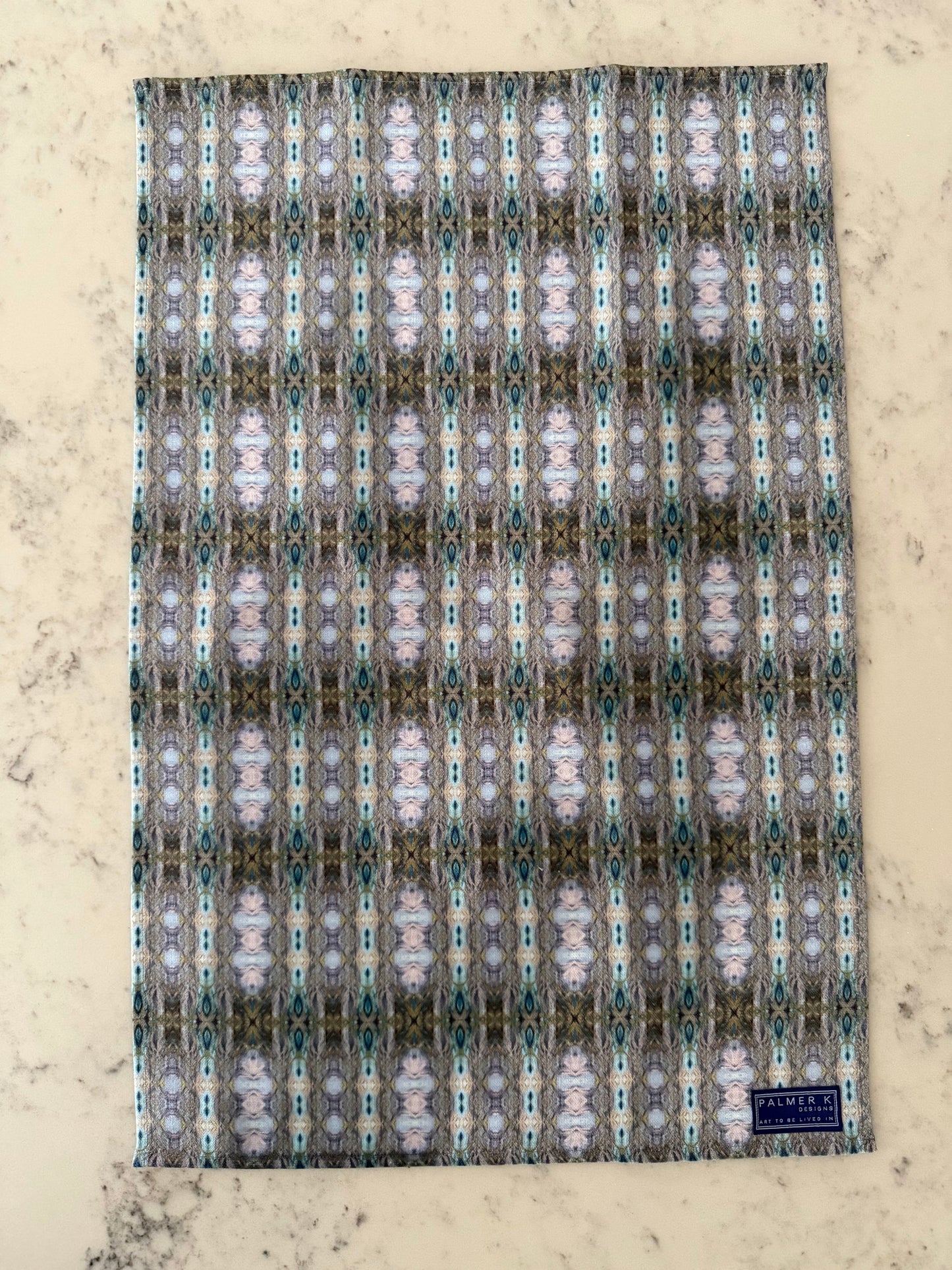 Crafted from 100% French linen woven from premium Normandy flax, each tea towel is printed and sewn in the USA and designed to bring lasting beauty into the kitchen and bath.  Measuring 16x24 inches, the fabric offers the ideal balance of structure and softness - becoming more supple with every wash while maintaining its integrity.

Each pattern begins as an original fine art painting, translated into a layered geometric composition that preserves the movement, texture, and tonal depth of the artwork.  The 