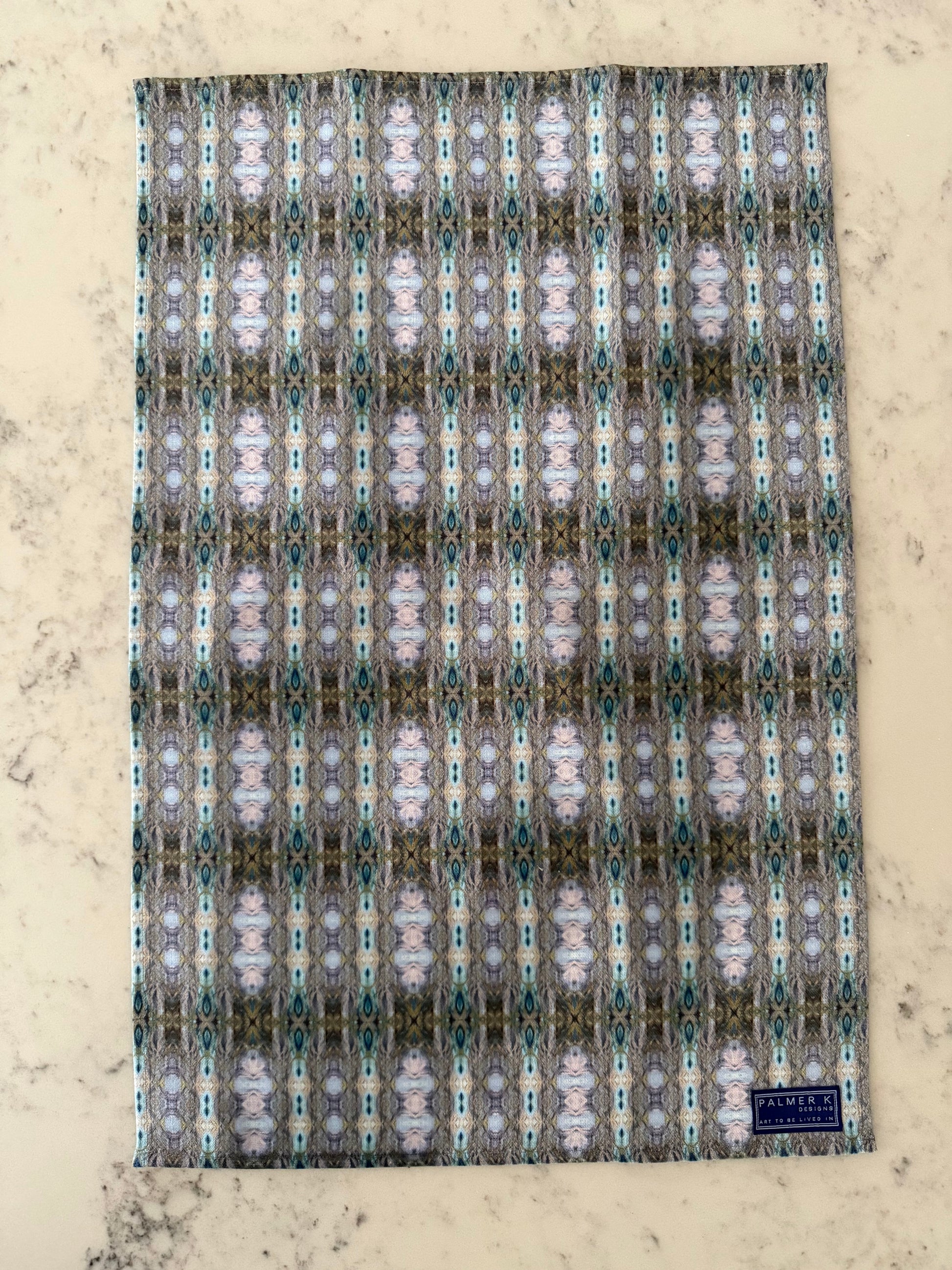 Crafted from 100% French linen woven from premium Normandy flax, each tea towel is printed and sewn in the USA and designed to bring lasting beauty into the kitchen and bath.  Measuring 16x24 inches, the fabric offers the ideal balance of structure and softness - becoming more supple with every wash while maintaining its integrity.

Each pattern begins as an original fine art painting, translated into a layered geometric composition that preserves the movement, texture, and tonal depth of the artwork.  The 